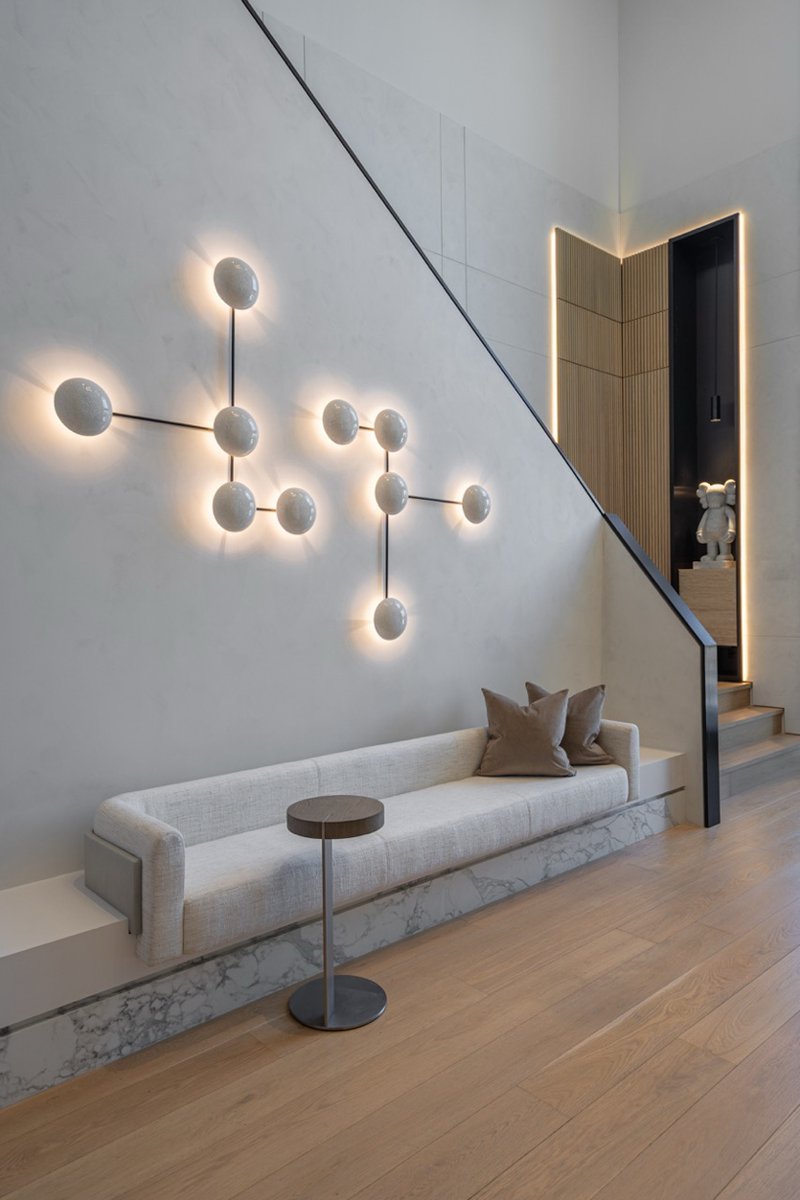 wood and porcelain interplay across curved interiors in florida renovation