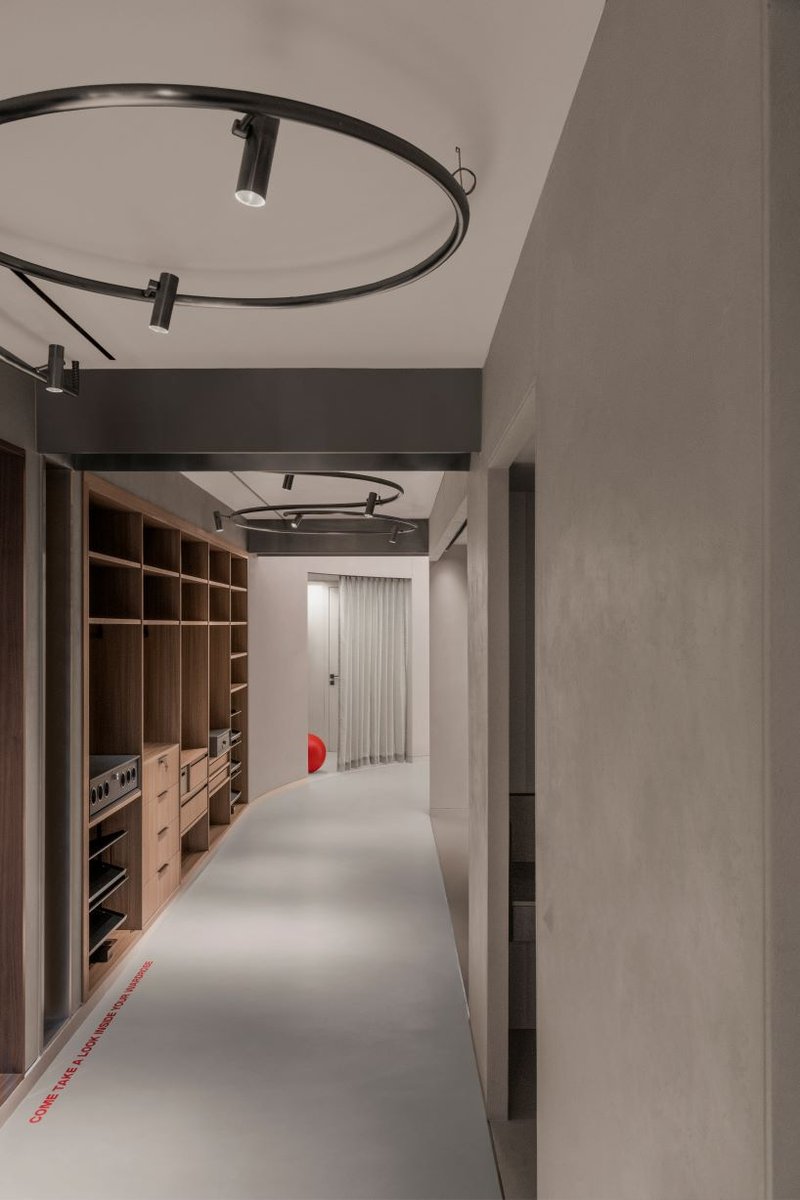 concrete and steel textures shape showroom in india organized as a continuous loop